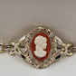 Gold Tone Hinged Bangle Bracelet with Red and White Lady Shell Cameo Charm 7"