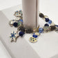 Kenneth Cole Silver Tone Blue White Snowman Christmas Winter Charm Bracelet